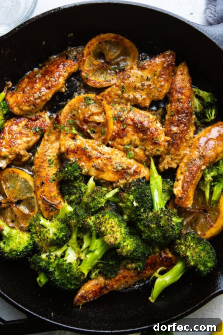 Weekly Meal Plan March 11-17 6 A vibrant photo showcasing perfectly golden chicken tenders nestled in a rustic cast iron skillet, beautifully accompanied by a vibrant side of tender broccoli florets and bright, savory slices of cooked lemons, enhancing the dish's fresh appeal.