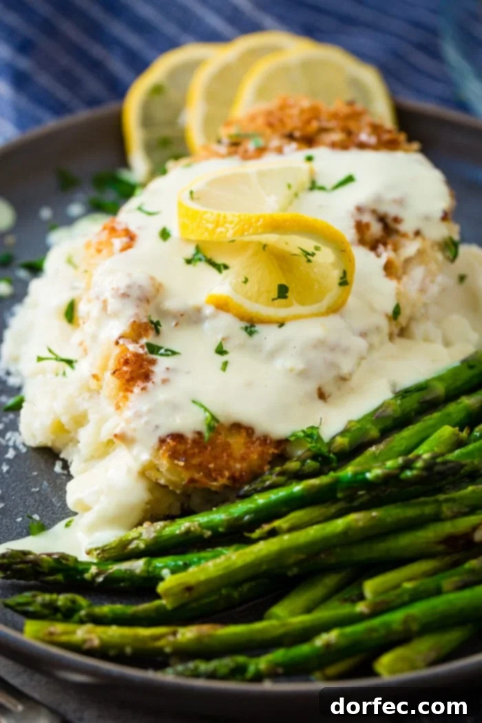 Weekly Meal Plan: April 22-28 8 Crispy panko-crusted chicken cutlets drizzled generously with a vibrant lemon cream sauce, presented on a plate with fresh parsley, highlighting its golden texture and rich appeal.