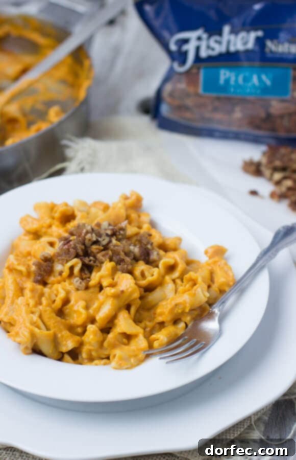 Creamy Pumpkin Pasta sauce with crunchy brown sugar pecans. You have to try to truly understand just how fantastic this pasta dish is! #fishernuts ohsweetbasil.com