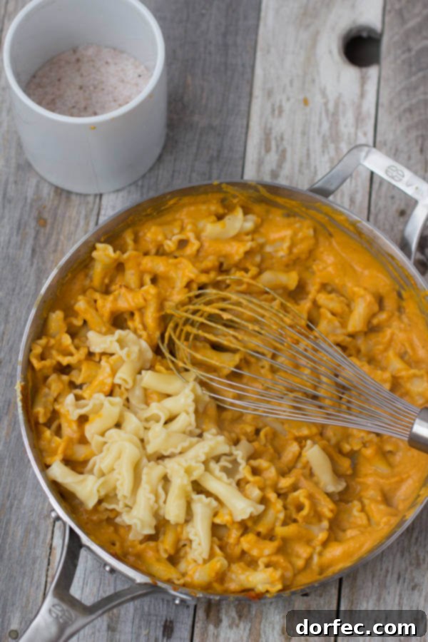 Creamy Pumpkin Pasta sauce with crunchy brown sugar pecans. You have to try to truly understand just how fantastic this pasta dish is! #fishernuts ohsweetbasil.com
