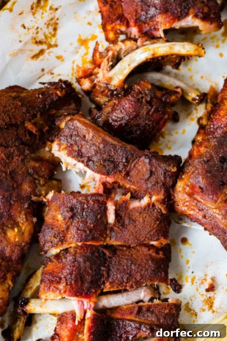 A photo of a rack of smoked ribs coated in a delicious dry rub.