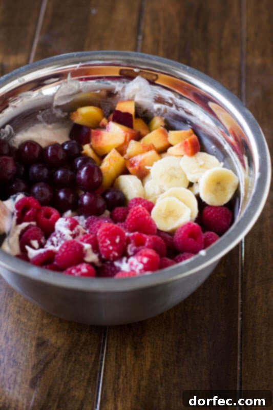 Dreamy Fluffy Cheesecake Fruit Salad 11 A close-up of the easy and delicious cheesecake fruit salad, a versatile recipe perfect for any potluck, BBQ, or as a sweet treat.