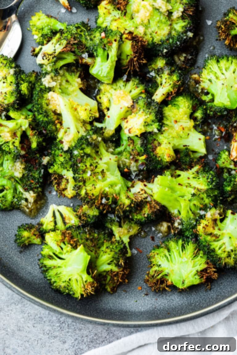 A generous serving of crispy broccoli florets presented on a large gray plate.