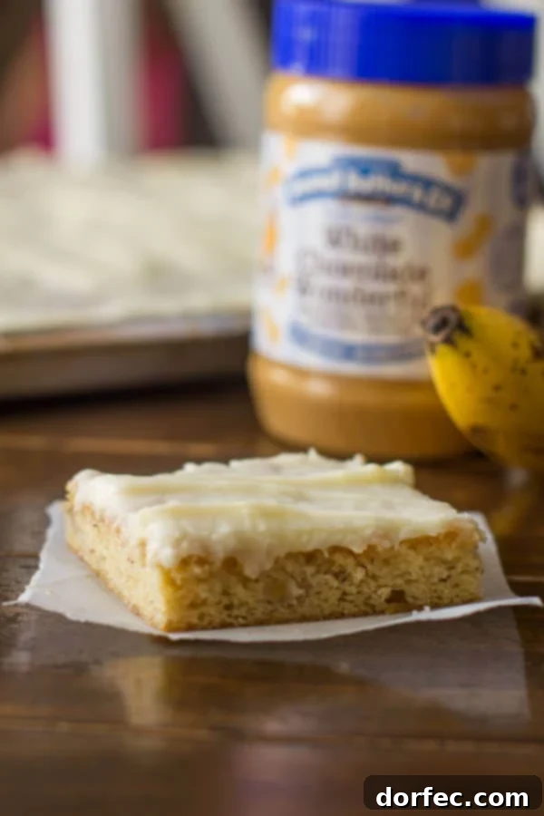 White Chocolate Peanut Butter Banana Cake with Cream Cheese Frosting Lush White Chocolate Peanut Butter Banana Cake bars with creamy frosting, perfect for any occasion