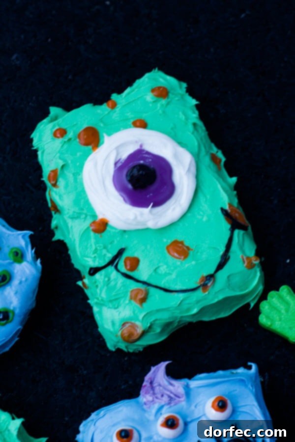 Decorating Homemade Monster Cookies with Kids Children happily decorating their Halloween monster cookies with colorful frosting and candies.