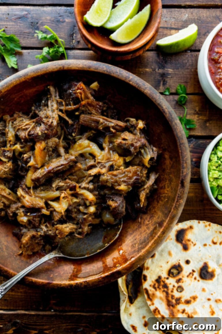 Perfectly crispy shredded beef on a baking sheet, with caramelized edges and rich color.