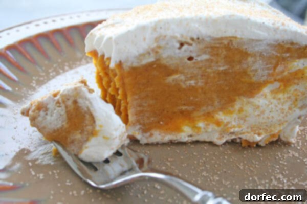 A decadent double-layered pumpkin pie, featuring a creamy texture and rich autumnal flavors.