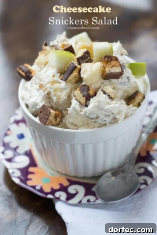 Elevate Your Dessert with This Cheesecake Snickers Salad Creamy Cheesecake Snickers Salad with Fresh Bananas and Apples