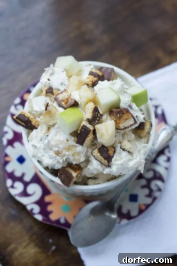 The Ultimate Indulgence: Cheesecake Snickers Salad Delightful Mix of Snickers, Cookies, and Cheesecake in a Salad