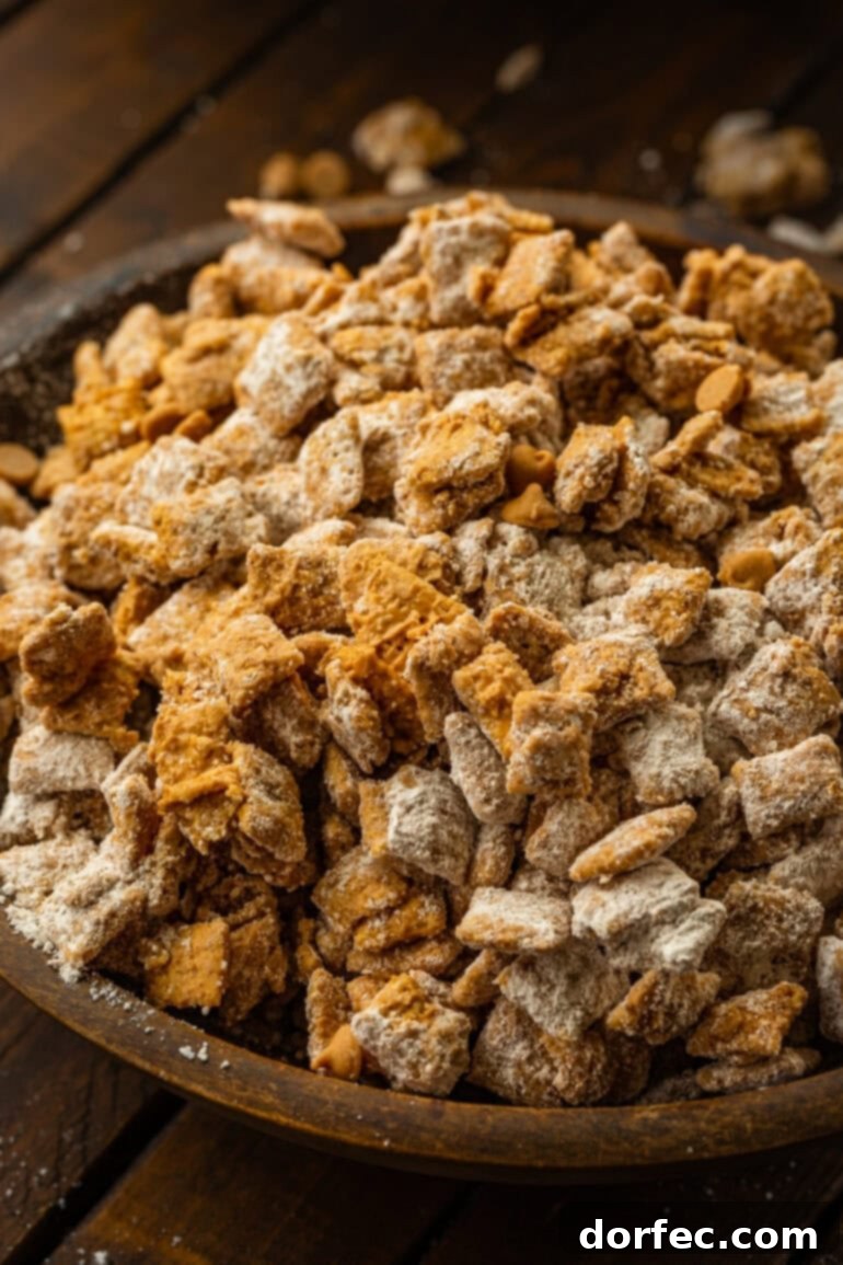 Double Peanut Butter Puppy Chow 2 Double Peanut Butter Muddy Buddies in a wooden bowl