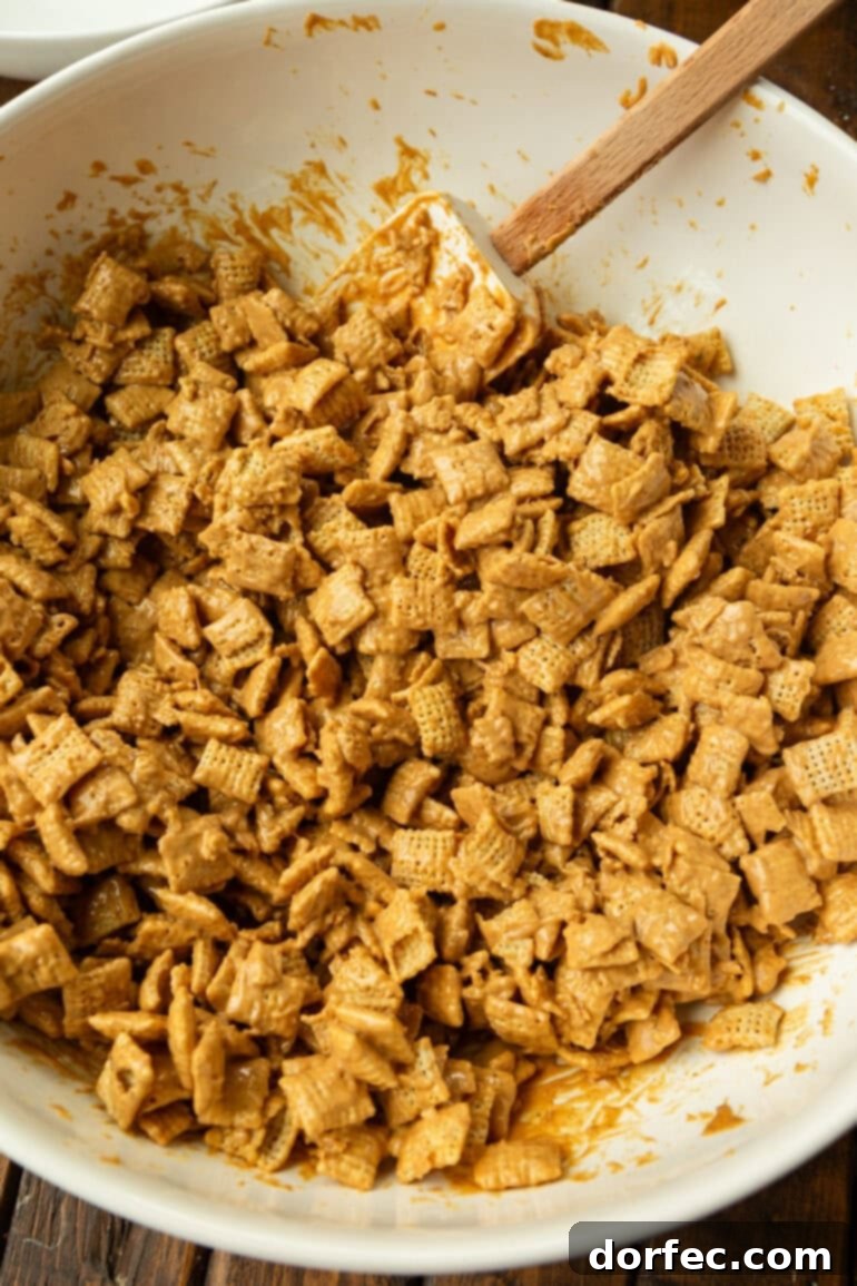 Double Peanut Butter Puppy Chow 6 Mixing peanut butter muddy buddies