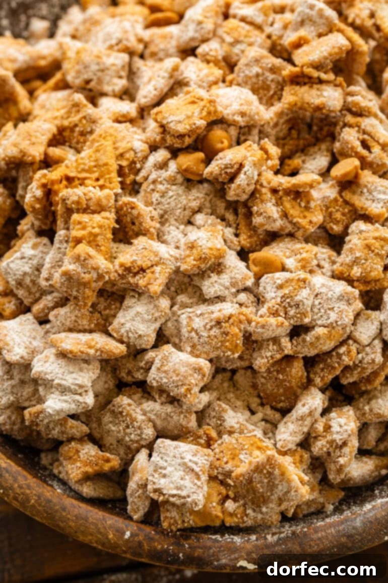 Double Peanut Butter Puppy Chow 7 Peanut butter muddy buddies coated in powdered sugar