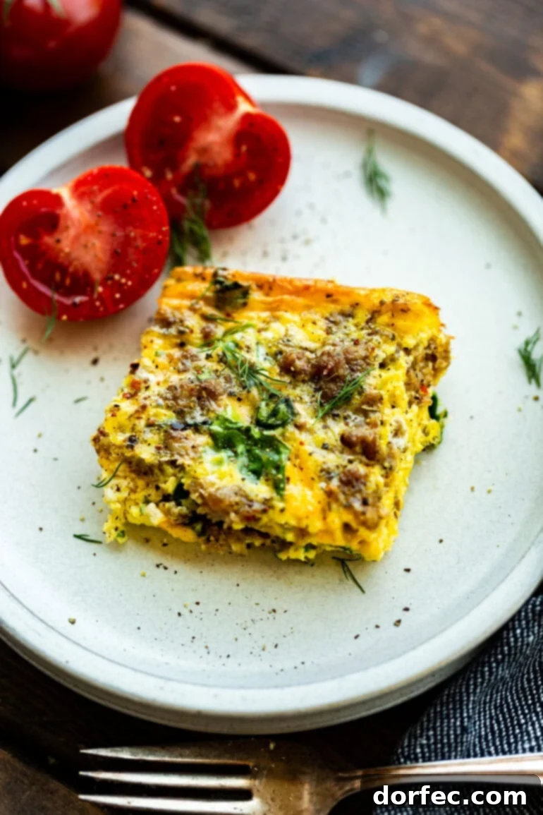 Spinach and sausage egg casserole with a side of tomato