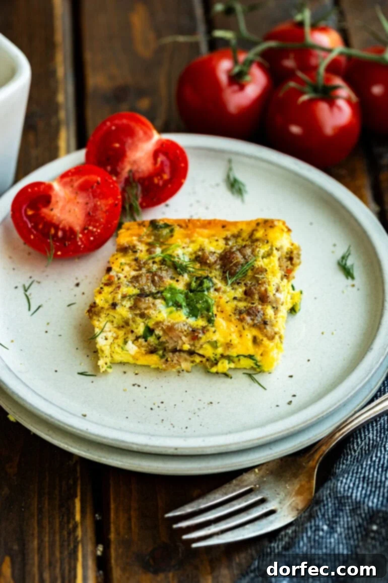 Sausage and egg casserole with tomato on the side
