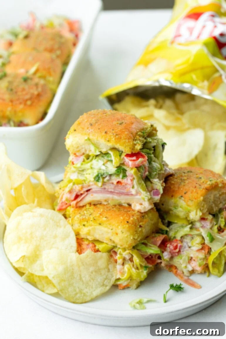 Italian sliders on a tray with potato chips