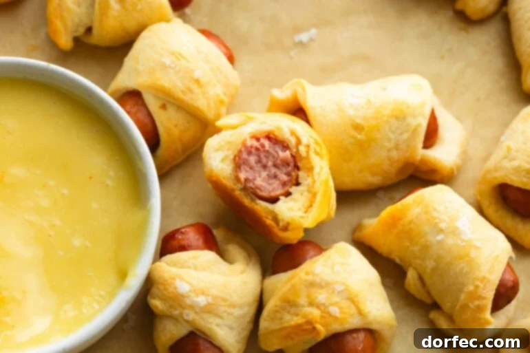 Pigs in a blanket with a bite taken out