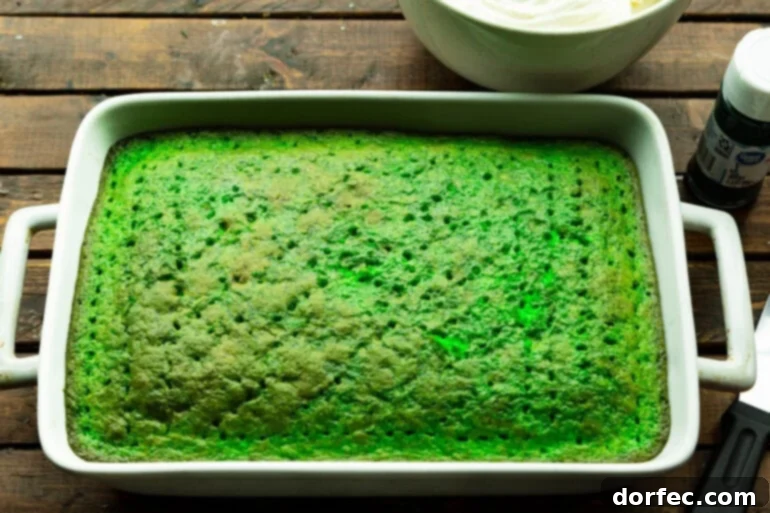 Shamrock Jello Poke Cake: A St. Patrick's Day Treat 4 Green Cake with Holes Poked All Over