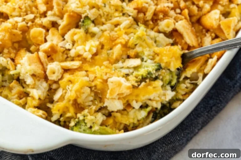 Effortless Chicken, Broccoli, and Rice Bake 2 Chicken Broccoli Rice Casserole in a white dish with a golden cracker topping