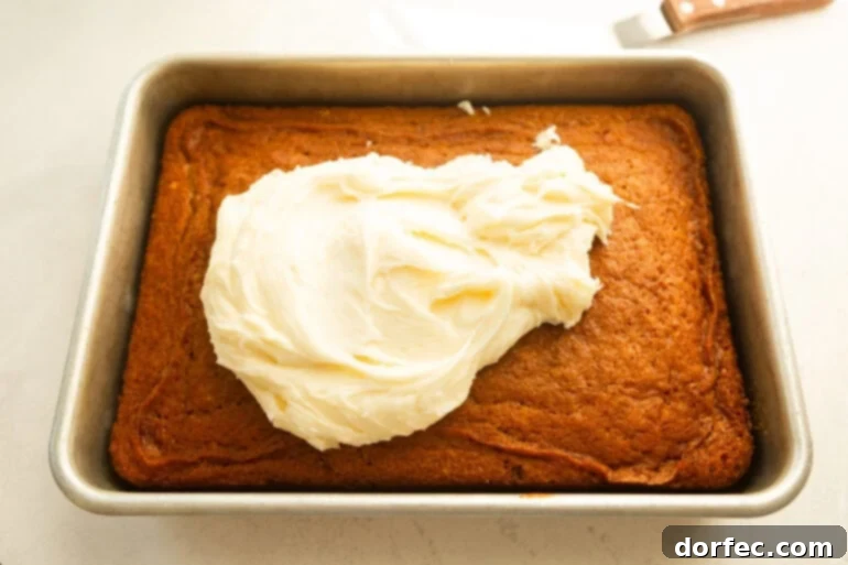 Carrot cake with cream cheese frosting ready to spread