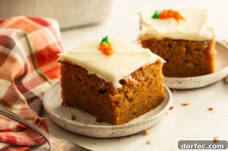 A slice of moist carrot cake on a plate