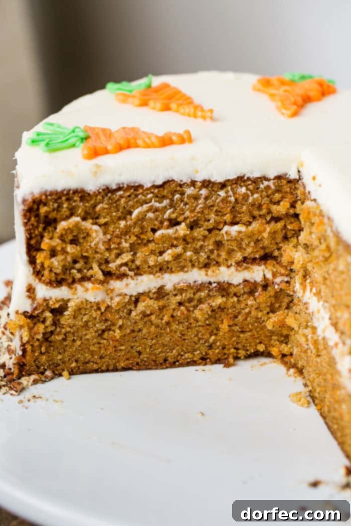 Ultimate Carrot Cake: Unbelievably Moist and Frosted to Perfection 2 Two-layer carrot cake with cream cheese frosting and white chocolate carrots