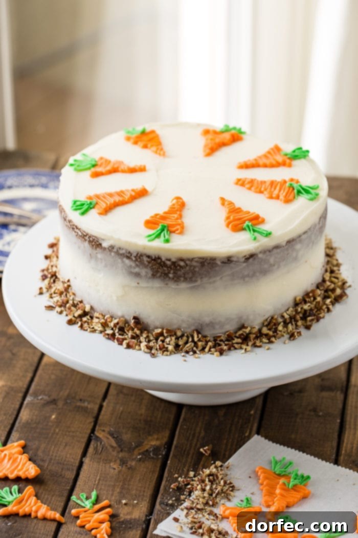 Ultimate Carrot Cake: Unbelievably Moist and Frosted to Perfection 3 Two-layer carrot cake with cream cheese frosting and chopped walnuts