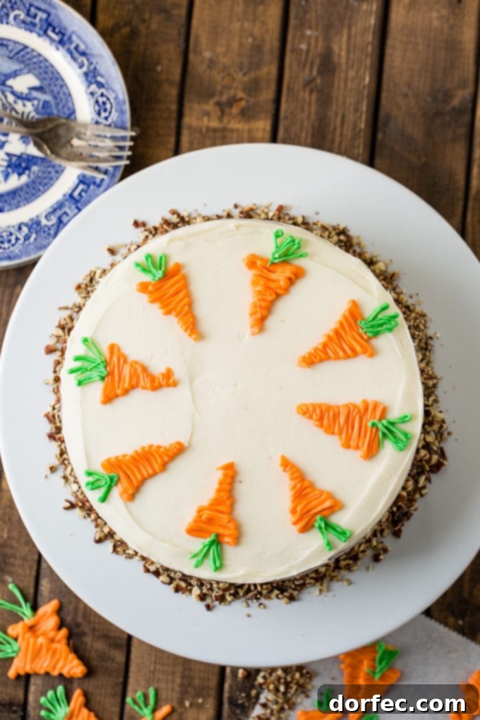 Ultimate Carrot Cake: Unbelievably Moist and Frosted to Perfection 5 Carrot cake with cream cheese frosting and white chocolate carrots from above