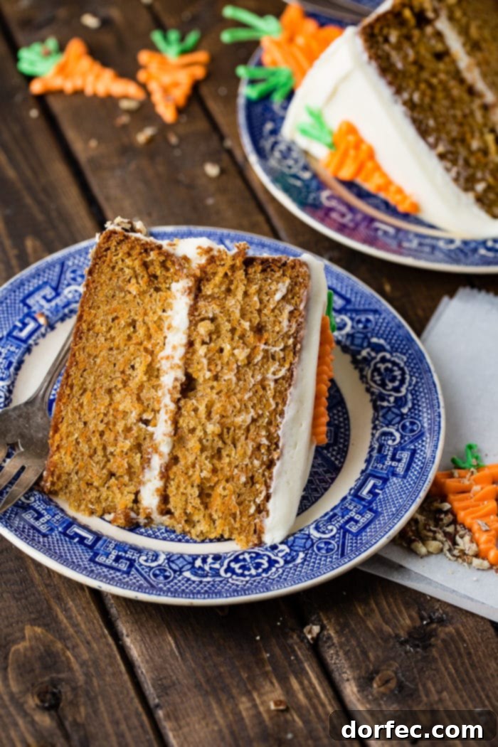 Ultimate Carrot Cake: Unbelievably Moist and Frosted to Perfection 6 Slice of two-layer carrot cake on a plate