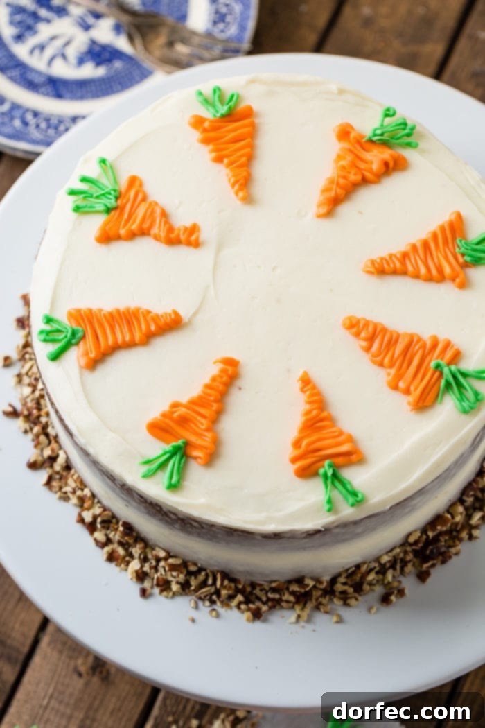 Ultimate Carrot Cake: Unbelievably Moist and Frosted to Perfection 8 Carrot cake with cream cheese frosting and white chocolate carrots from above