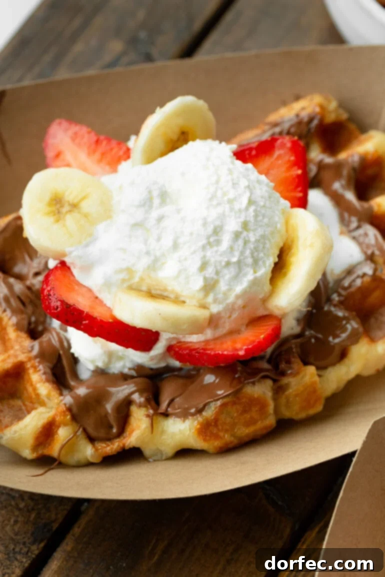 Mascarpone Dream Cream 2 Liege waffle topped with Nutella, strawberries, bananas, and mascarpone whipped cream