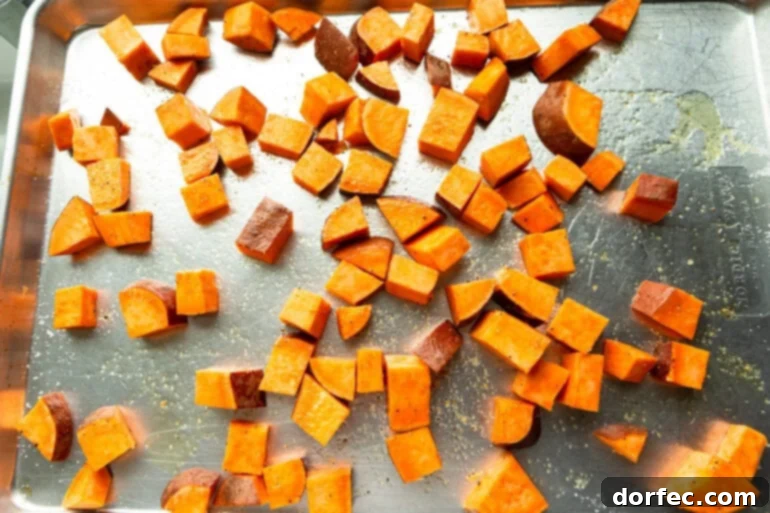 Roasted sweet potatoes on a sheet pan