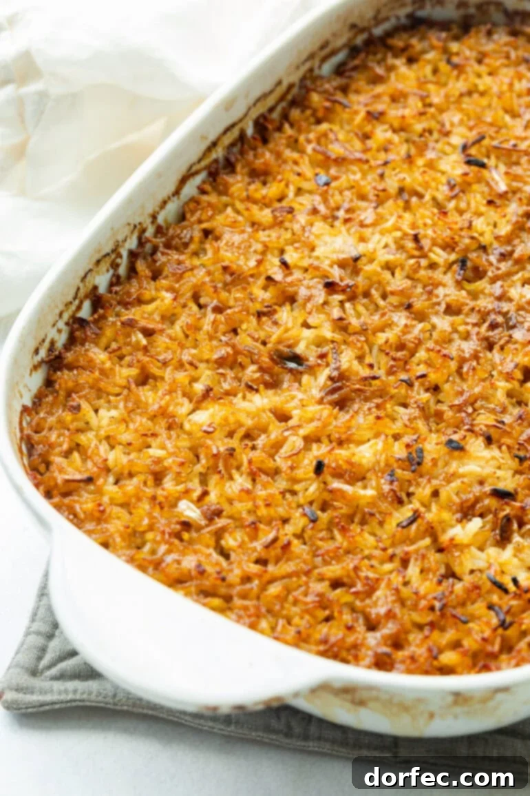 French Onion Rice 3 A baking pan filled with golden-brown stick of butter rice, cooling on a kitchen counter, ready to be fluffed and served.