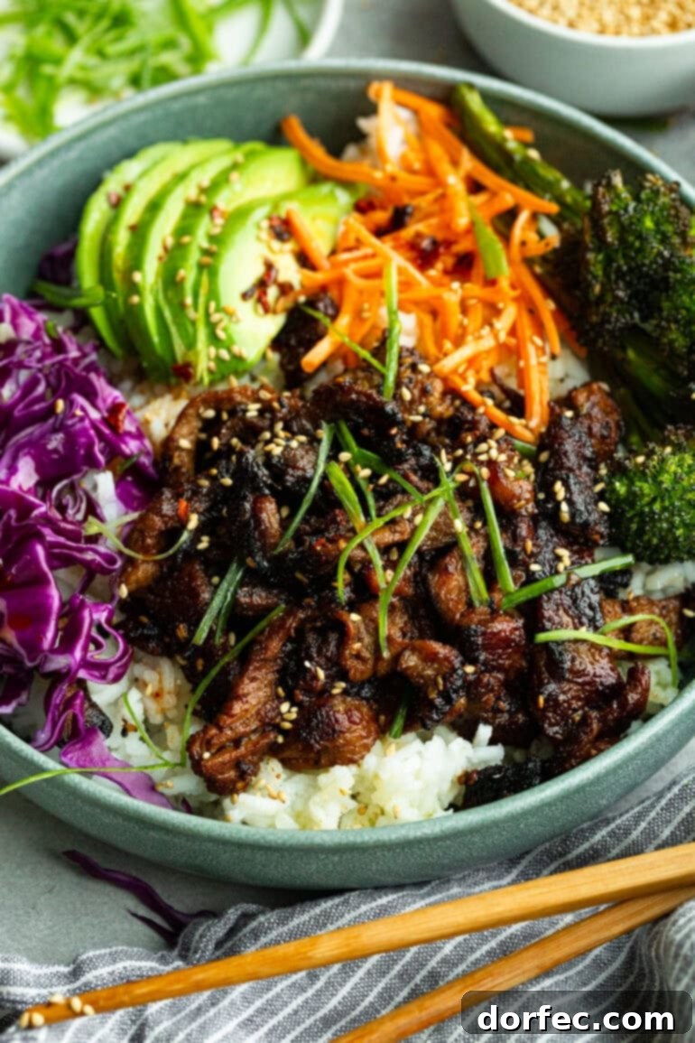 A colorful and healthy Korean beef bowl with a variety of fresh toppings.