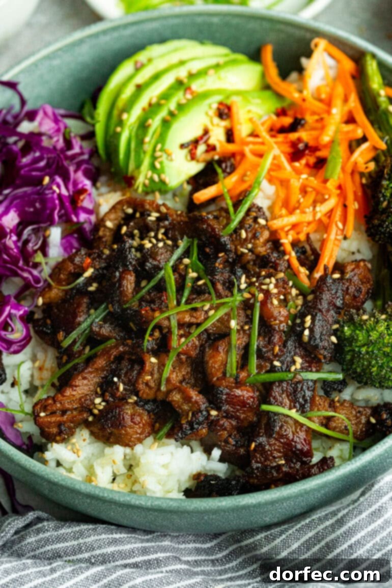 An overhead shot of a beautifully assembled Korean beef rice bowl ready to be eaten.