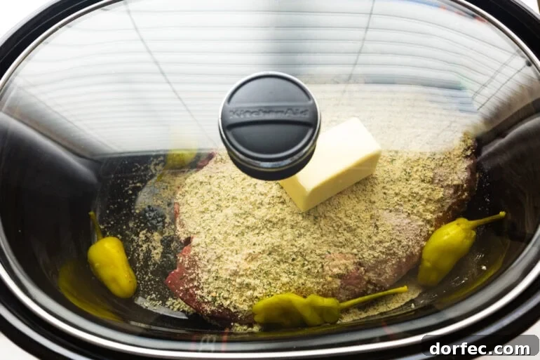 Mississippi Pot Roast Slow Cooker Recipe for Tender, Flavorful Beef 4 a slow cooker with all the ingredients for mississippi pot roast inside ready to cook with the lid on