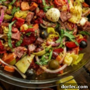 Crowd Pleasing Pasta Salads Made Easy for Potlucks 6 Antipasto pasta salad with cured meats, cheeses, and marinated vegetables.