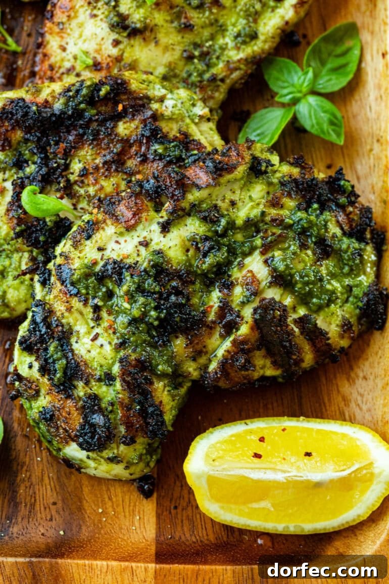 How Long to Grill Chicken Breast for Juicy Results Every Time 4 a grilled chicken breast lathered in pesto