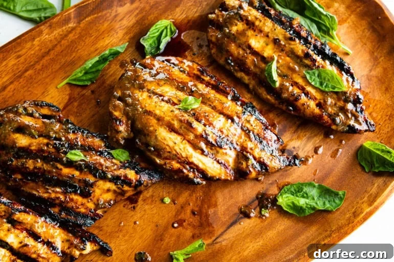 How Long to Grill Chicken Breast for Juicy Results Every Time 7 several grilled chicken breasts with basil leaves scattered about it