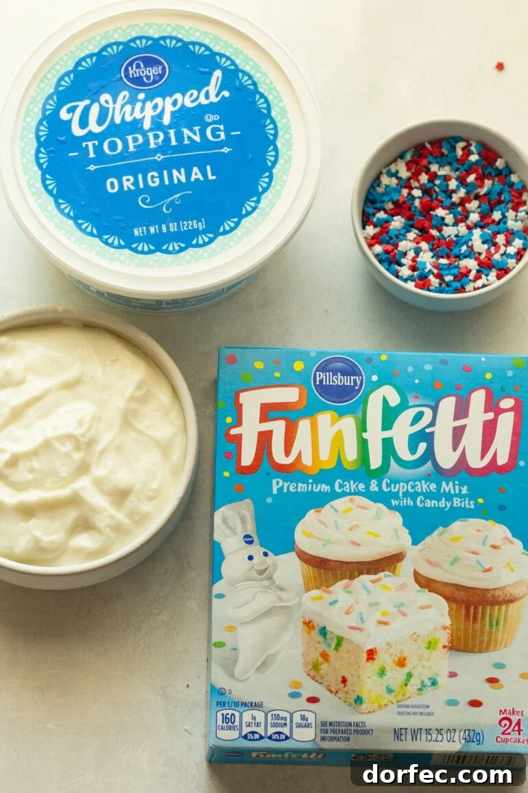 Ingredients: cake mix, sprinkles, and whipped topping for a fluffy cake batter dip topped with sprinkles.