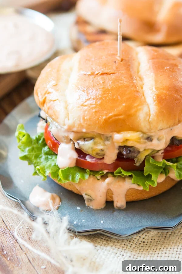 Ultimate Homemade Burger Sauce Recipe for Juicy Flavor 6 a juicy cheeseburger with burger sauce dripping down the sides